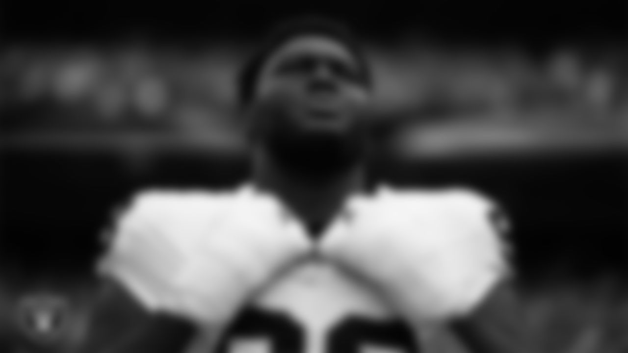 Las Vegas Raiders defensive tackle Byron Young (93) during the national anthem before the regular season away game against the Denver Broncos at Empower Field at Mile High.