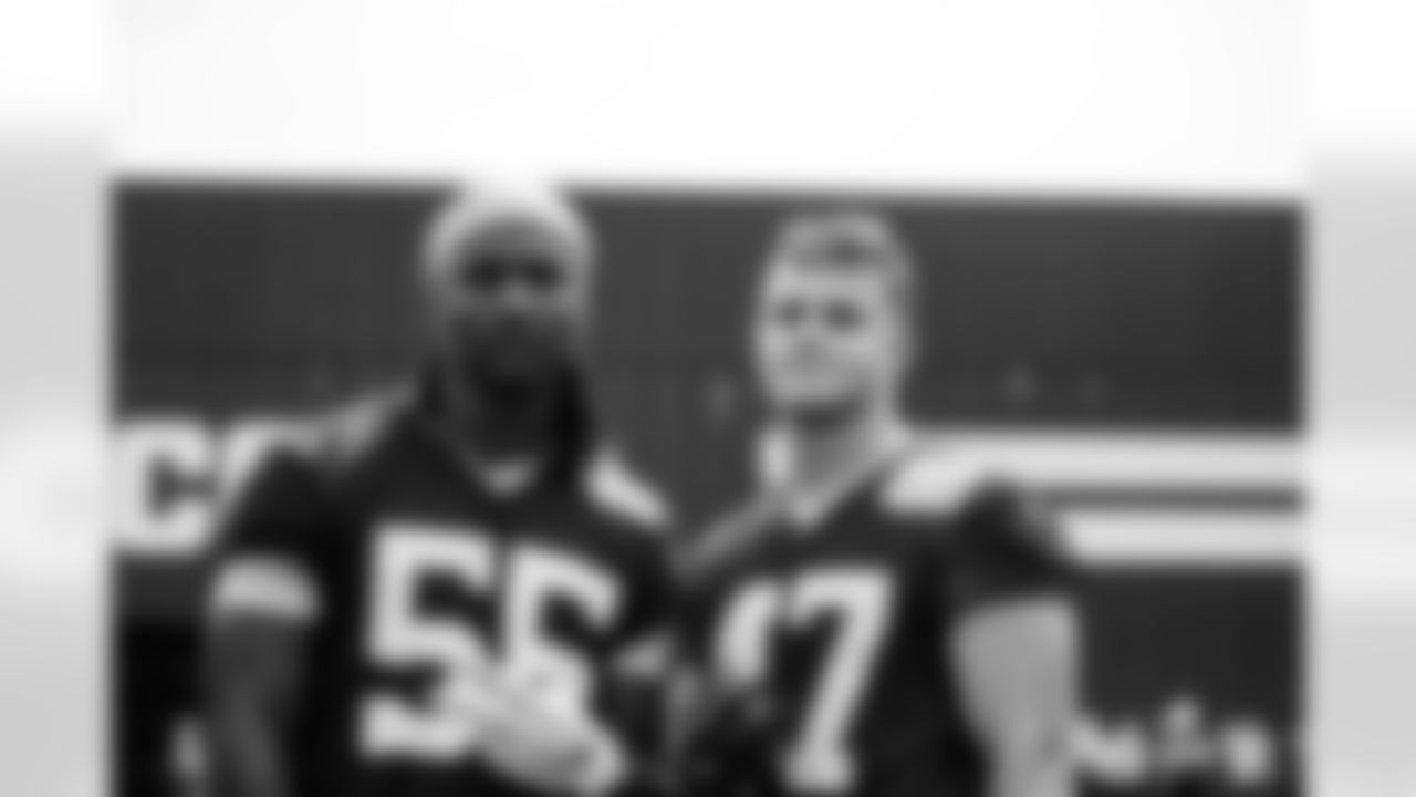DE Isaiah Land #55 and LB Liam Anderson #47