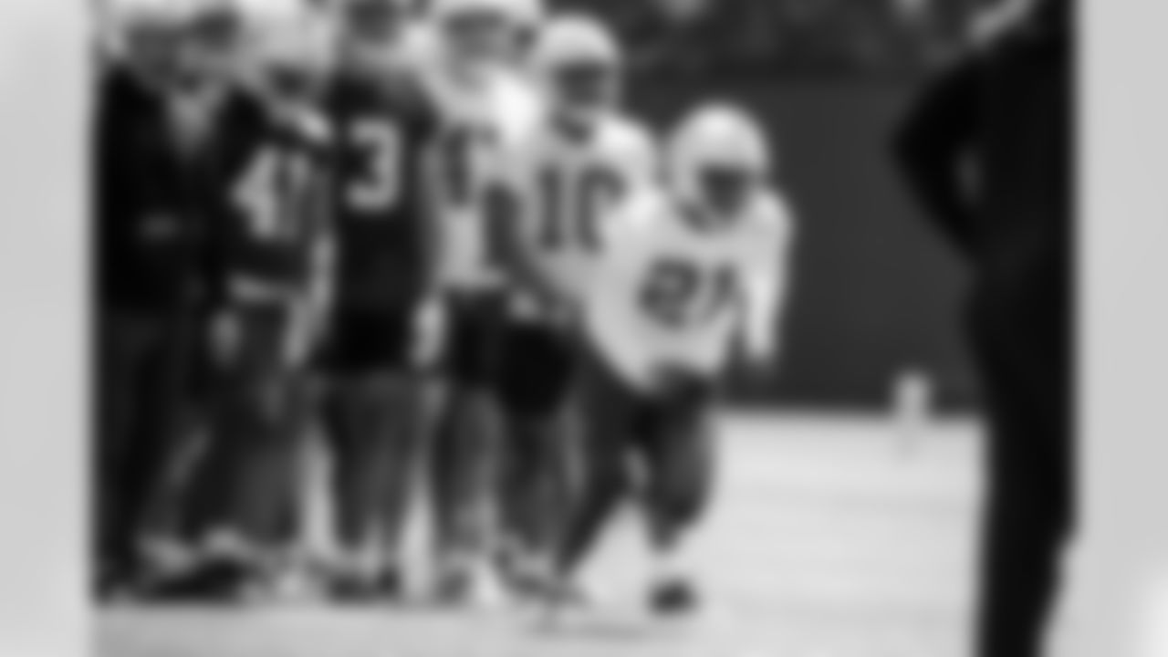 Brian Mason Special Teams Coordinator, DT Adetomiwa Adebawore #95 and RBDJ Giddens#21